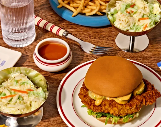 Fried chicken sandwich with fries and slaw